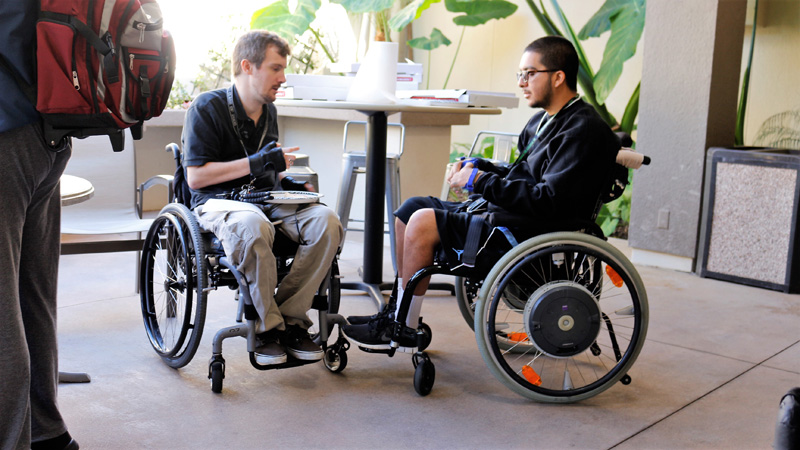 Staff member consulting with a person with a disability